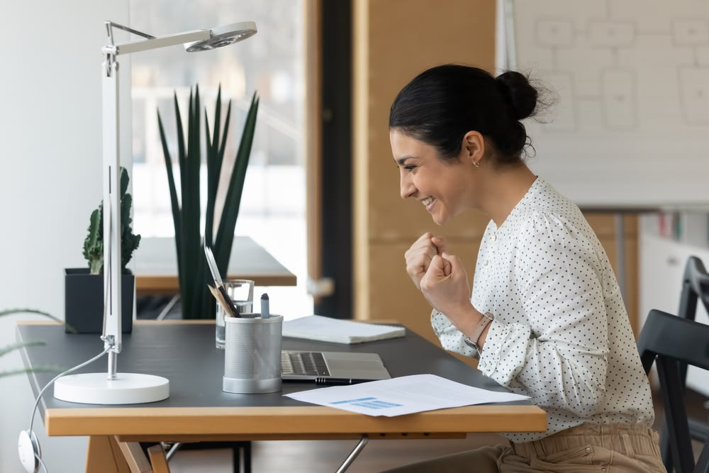 Business owner confidently delegating tasks to a virtual assistant, depicted through a seamless digital connection, symbolizing control and efficiency.
